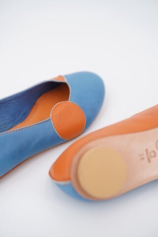 Detailed side profile of the blue KRUG loafer showing polished calfskin leather and a thick rubber sole.